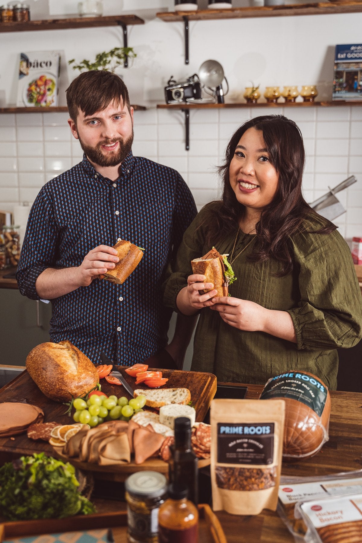 Kim Le and Josh Nixon, co-founders of Prime Roots, with sandwiches in the test kitchen